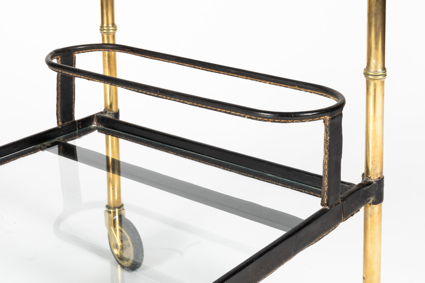 Jacques Adnet bar cart bottle holder detail in saddle-stitched leather and gilt brass, French design, 1950s
