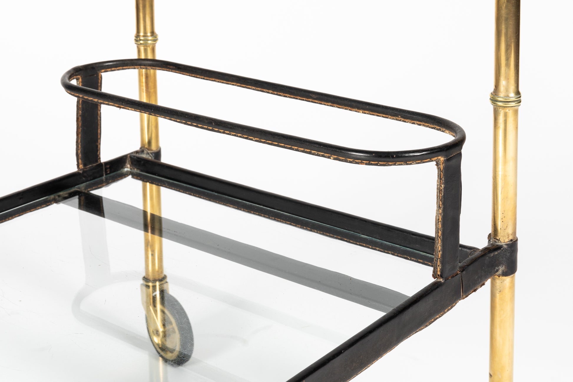Jacques Adnet bar cart bottle holder detail in saddle-stitched leather and gilt brass, French design, 1950s